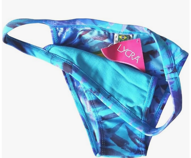 Bikini brasileño azul NORDESTINA, estampado vibrante, top con tirantes ajustables y cuello en V. Hecho con 85% poliamida y 15% elastano, perfecto para la playa y piscina.